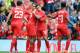 LIVERPOOL, ENGLAND - AUGUST 10: Daniel Sturridge (C) of Liverpool celebrates with team-mate Philippe Coutinho after he scores the first goal of the game for his side during the Pre Season Friendly match between Liverpool and Borussia Dortmund at Anfield