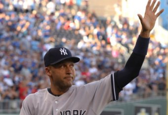 KANSAS CITY, MO - AUGUST 25: Derek Jeter #2 of the New York Yankees waves to the crowd after a farewell ceremony in his honor prior to a game against the Kansas City Royals at Kauffman Stadium on August 25, 2014 in Kansas City, Missouri. (Photo by Ed Zur