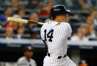 NEW YORK, NY - AUGUST 19: Martin Prado #14 of the New York Yankees hits a two run double in the sixth inning against the Houston Astros at Yankee Stadium on August 19, 2014 in the Bronx borough of New York City. (Photo by Mike Stobe/Getty Images)