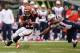CINCINNATI, OH - OCTOBER 6: BenJarvus Green-Ellis #42 of the Cincinnati Bengals breaks a tackle attempt from Jerod Mayo #51 of the New England Patriots in the first quarter while gaining yardage at Paul Brown Stadium on October 6, 2013 in Cincinnati, Ohi