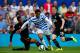 LONDON, ENGLAND - AUGUST 16: Curtis Davies of Hull City slides in to tackle Loic Remy of Queens Park Rangers during the Barclays Premier League match between Queens Park Rangers and Hull City at Loftus Road on August 16, 2014 in London, England. (Photo