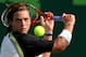 KEY BISCAYNE, FL - MARCH 23: Brendan Evans of the USA returns a shot to Juan Carlos Ferrero of Spain during the NASDAQ-100 Open at the Crandon Park Tennis Center on March 23, 2005 in Key Biscayne, Florida. (Photo by Ezra Shaw/Getty Images)