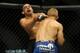 May 24, 2014; Las Vegas, NV, USA; TJ Dillashaw (blue) throws a punch at Renan Barao (red) during their UFC 173 bantamweight championship bout at MGM Grand Garden Arena. Dillashaw won the bout by way of TKO. Mandatory Credit: Stephen R. Sylvanie-USA TOD