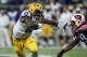 Aug 30, 2014; Houston, TX, USA; LSU Tigers quarterback Anthony Jennings (10) runs with the ball during the third quarter against the Wisconsin Badgers at NRG Stadium. The Tigers defeated the Badgers 28-24. Mandatory Credit: Troy Taormina-USA TODAY Sports