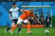 SAO PAULO, BRAZIL - JULY 09: Nigel de Jong of the Netherlands challenges Lionel Messi of Argentina during the 2014 FIFA World Cup Brazil Semi Final match between the Netherlands and Argentina at Arena de Sao Paulo on July 9, 2014 in Sao Paulo, Brazil. (P