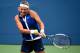 NEW YORK, NY - AUGUST 26: Victoria Azarenka of Belarus returns a shot against Misaki Doi of Japan during their women's singles first round match on Day Two of the 2014 US Open at the USTA Billie Jean King National Tennis Center on August 26, 2014 in the