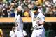 OAKLAND, CA - SEPTEMBER 01: Adam Dunn #10 of the Oakland Athletics is congratulated by Josh Reddick #16 after Dunn hit a two-run homer against the Seattle Mariners in the bottom of the first inning at O.co Coliseum on September 1, 2014 in Oakland, Califo
