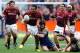 DUNEDIN, NEW ZEALAND - SEPTEMBER 28: Willis Halaholo of Southland attempts to bust the attempted tackle of Kieran Moffat of Otago during the round seven ITM Cup match between Otago and Southland at Forsyth Barr Stadium on September 28, 2013 in Dunedin, N