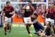 DUNEDIN, NEW ZEALAND - SEPTEMBER 28: Willis Halaholo of Southland attempts to bust the attempted tackle of Kieran Moffat of Otago during the round seven ITM Cup match between Otago and Southland at Forsyth Barr Stadium on September 28, 2013 in Dunedin, N