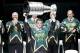 DALLAS, TX - MARCH 08: Former Dallas Star Derian Hatcher carries the Stanley Cup before Mike Modano has his jersey retired before the Dallas Stars play against the Minnesota Wild on March 8, 2014 at American Airlines Center in Dallas, Texas.(Photo by Thom