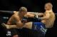 May 24, 2014; Las Vegas, NV, USA; TJ Dillashaw (blue) lands a kick on Renan Barao (red) during their UFC 173 bantamweight championship bout at MGM Grand Garden Arena. Dillashaw won the bout by way of TKO. Mandatory Credit: Stephen R. Sylvanie-USA TODAY