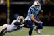NEW ORLEANS, LA - AUGUST 15: Junior Galette #93 of the New Orleans Saints tackles Jake Locker #10 of the Tennessee Titans during a preseason game between the New Orleans Saints and the Tennessee Titans at Mercedes-Benz Superdome on August 15, 2014 in New
