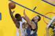 OAKLAND, CA - NOVEMBER 24: Harrison Barnes #40 of the Golden State Warriors goes up for the dunk against Nikola Pekovic #14 of the Minnesota Timberwolves on November 24, 2012 at Oracle Arena in Oakland, California. NOTE TO USER: User expressly acknowledge