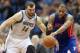 Apr 6, 2013; Minneapolis, MN, USA; Minnesota Timberwolves center Nikola Pekovic (14) and Detroit Pistons center Greg Monroe (10) fight for a loose ball in the second half at Target Center. The Timberwolves won 107-101. Mandatory Credit: Jesse Johnson-USA