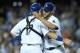 LOS ANGELES, CA - JULY 10: Starting pitcher Clayton Kershaw #22 of the Los Angeles Dodgers embraces catcher A.J. Ellis #17 after Kershaw finished the nintth inning for a complete game victory over the San Diego Padres at Dodger Stadium on July 10, 2014 i