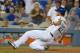 Sep 2, 2014; Los Angeles, CA, USA; Los Angeles Dodgers pitcher Clayton Kershaw (22) slides into third base in the fifth inning against the Washington Nationals at Dodger Stadium. Mandatory Credit: Kirby Lee-USA TODAY Sports
