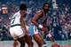 BOSTON, MA - 1980: Brian Taylor #14 of the San Diego Clippers dribbles the ball against the Boston Celtics during a game played circa 1980 at the Boston Garden in Boston, Massachussets. NOTE TO USER: User expressly acknowledges and agrees that, by downloa
