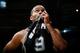 ATLANTA, GA - OCTOBER 17: Tony Parker #9 of the San Antonio Spurs wipes sweat from his face during a timeout against the Atlanta Hawks at Philips Arena on October 17, 2013 in Atlanta, Georgia. NOTE TO USER: User expressly acknowledges and agrees that, b