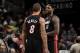 CLEVELAND, OH - NOVEMBER 27: Michael Beasley #8 and LeBron James #6 of the Miami Heat joke around during a break in the action against the Cleveland Cavaliers at The Quicken Loans Arena on November 27, 2013 in Cleveland, Ohio. NOTE TO USER: User expressl
