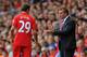 LIVERPOOL, ENGLAND - AUGUST 26: Liverpool Manager Brendan Rogers encourages Fabio Borini of Liverpool during the Barclays Premier League match between Liverpool and Manchester City at Anfield on August 26, 2012 in Liverpool, England. (Photo by Michael R
