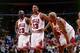 CHICAGO - MAY 20: (L to R) Michael Jordan #23, Scottie Pippen #33 and Dennis Rodman #91of the Chicago Bulls look on during a break in game action during the NBA Eastern Conference Finals against the Miami Heat at the United Center on May 20, 1997 in Chic
