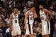 SAN ANTONIO - MAY 30: Tony Parker #9, Manu Ginobili #20 and Tim Duncan #21 of the San Antonio Spurs react as they loose to the Phoenix Suns, 111-106, in Game four of the Western Conference Finals during the 2005 NBA Playoffs at the SBC Center on May 30,