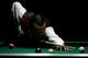 DOHA, QATAR - DECEMBER 09: Fikri Muhammad Zulfikri of Indonesia plays a shot in his match against Chan Keng Kwang of Singapore during the Men's 9 Ball Pool competition at the 15th Asian Games Doha 2006 at Al Sadd Multi Purpose Hall on December 9, 2006 in