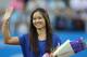 Li Na, who announced her retirement last week, waves to the crowd at the Wuhan Open.