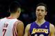 HOUSTON, TX - JANUARY 08: Steve Nash #10 of the Los Angeles Lakers waits on the court alongside Jeremy Lin #7 of the Houston Rockets at Toyota Center on January 8, 2013 in Houston, Texas. Nash became just the fifth player in NBA history to reach 10,000 c