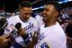 KANSAS CITY, MO - SEPTEMBER 30: Salvador Perez #13 of the Kansas City Royals celebrates with teammates after they defeated the Oakland Athletics 9 to 8 in the 12th inning of their American League Wild Card game at Kauffman Stadium on September 30, 2014 i