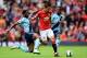 MANCHESTER, ENGLAND - SEPTEMBER 27: Angel di Maria of Manchester United is tackled by Alexandre Song of West Ham during the Barclays Premier League match between Manchester United and West Ham United at Old Trafford on September 27, 2014 in Manchester, E