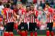SOUTHAMPTON, ENGLAND - SEPTEMBER 27: Ryan Bertrand (2nd R) of Southampton celebrates their victory with Nathaniel Clyne (C) and their team-mates during the Barclays Premier League match between Southampton and Queens Park Rangers at St Mary's Stadium on