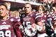 STARKVILLE, MS - OCTOBER 04: Dak Prescott #15 of the Mississippi State Bulldogs celebrates with fans following a game against the Texas A&M Aggies at Davis Wade Stadium on October 4, 2014 in Starkville, Mississippi. Mississippi State won the game 48-31.