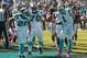 Newton celebrates a touchdown with a fourth-stringer and a rookie.