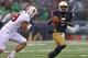 SOUTH BEND, IN - OCTOBER 04: Everett Golson #5 of the Notre Dame Fighting Irish is pursued by Kevin Anderson #48 of the Standford Cardinal at Notre Dame Stadium on October 4, 2014 in South Bend, Indiana. Notre Dame defeated Standford 17-14. (Photo by Jo