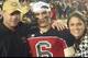 Dylan's father, Jeff, and mother, Rhonda, with him after a game at Saint Stanislaus.