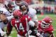 Dylan Favre carries two Arkansas defenders over the goal line.