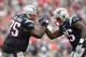FOXBORO, MA - SEPTEMBER 21: Vince Wilfork #75 of the New England Patriots high fives Chandler Jones #95 after intercepting the ball during the fourth quarter against the Oakland Raiders at Gillette Stadium on September 21, 2014 in Foxboro, Massachusetts.