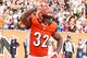 CINCINNATI, OH - OCTOBER 12: Jeremy Hill #32 of the Cincinnati Bengals celebrates a touchdown by dancing the 'Ickey Shuffle' during the fourth quarter against the Carolina Panthers at Paul Brown Stadium on October 12, 2014 in Cincinnati, Ohio. Cincinnati