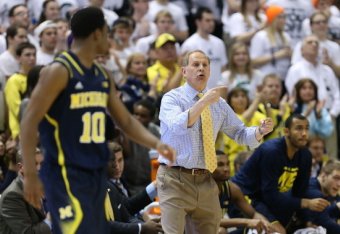 EAST LANSING, MI - JANUARY 25: Michigan Wolverines head basketball coach John Beilein shouts out instructions during the second half of the game against the Michigan State Spartans at Breslin Center on January 25, 2014 in East Lansing, Michigan. The Wolve