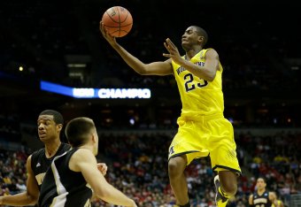 Mar 20, 2014; Milwaukee, WI, USA; Michigan Wolverines guard Caris LeVert (23) lays the ball up during the second round of the 2014 NCAA Tournament against the Wofford Terriers at BMO Harris Bradley Center. Mandatory Credit: Jeff Hanisch-USA TODAY Sports