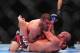Dec 29, 2012; Las Vegas, NV, USA; Jim Miller (top) and Joe Lauzon (bottom) lock up during UFC 155 at the MGM Grand Garden Arena. Mandatory Credit: Gary A. Vasquez-USA TODAY Sports