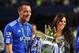 LONDON, ENGLAND - MAY 09: John Terry of Chelsea celebrates with wife Toni and his childrenas they win the title after the Barclays Premier League match between Chelsea and Wigan Athletic at Stamford Bridge on May 9, 2010 in London, England. Chelsea won 8