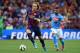 GENEVA, SWITZERLAND - AUGUST 06: Ivan Rakitic (L) of FC Barcelona in action against Lorenzo Insigne of SSC Napoli during the pre-season friendly match between FC Barcelona and SSC Napoli on August 6, 2014 in Geneva, Switzerland. (Photo by Valerio Pennic