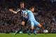 MANCHESTER, ENGLAND - OCTOBER 29: David Silva of Manchester City is tackled by Ryan Taylor of Newcastle United during the Capital One Cup Fourth Round match between Manchester City and Newcastle United at Etihad Stadium on October 29, 2014 in Manchester,