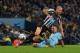 MANCHESTER, ENGLAND - OCTOBER 29: Aleksandar Kolarov of Manchester City tackles Gabriel Obertan of Newcastle United in the area during the Capital One Cup Fourth Round match between Manchester City and Newcastle United at Etihad Stadium on October 29, 201