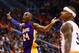 Oct 29, 2014; Phoenix, AZ, USA; Los Angeles Lakers guard Kobe Bryant (24) reacts to a foul call in the second half alongside Phoenix Suns guard Isaiah Thomas during the home opener at US Airways Center. The Suns defeated the Lakers 119-99. Mandatory Credi