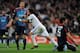 MADRID, SPAIN - MARCH 16: Marcelo (L) of Real Madrid celebrates scoring his side opening goal past Dejan Lovren of Lyon during the UEFA Champions League round of 16 second leg match between Real Madrid and Lyon at Estadio Santiago Bernabeu on March 16, 2