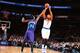 NEW YORK, NY - NOVEMBER 2: Carmelo Anthony #7 of the New York Knicks takes the shot that scores him his 20,000th career point against Michael Kidd-Gilchrist #14 of the Charlotte Hornets during the game on November 2, 2014 at Madison Square Garden in New Y