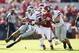 Oct 18, 2014; Norman, OK, USA; Oklahoma Sooners linebacker Jordan Evans (26) tackles Kansas State Wildcats quarterback Jake Waters (15) during the first quarter at Gaylord Family - Oklahoma Memorial Stadium. Mandatory Credit: Kevin Jairaj-USA TODAY Sports